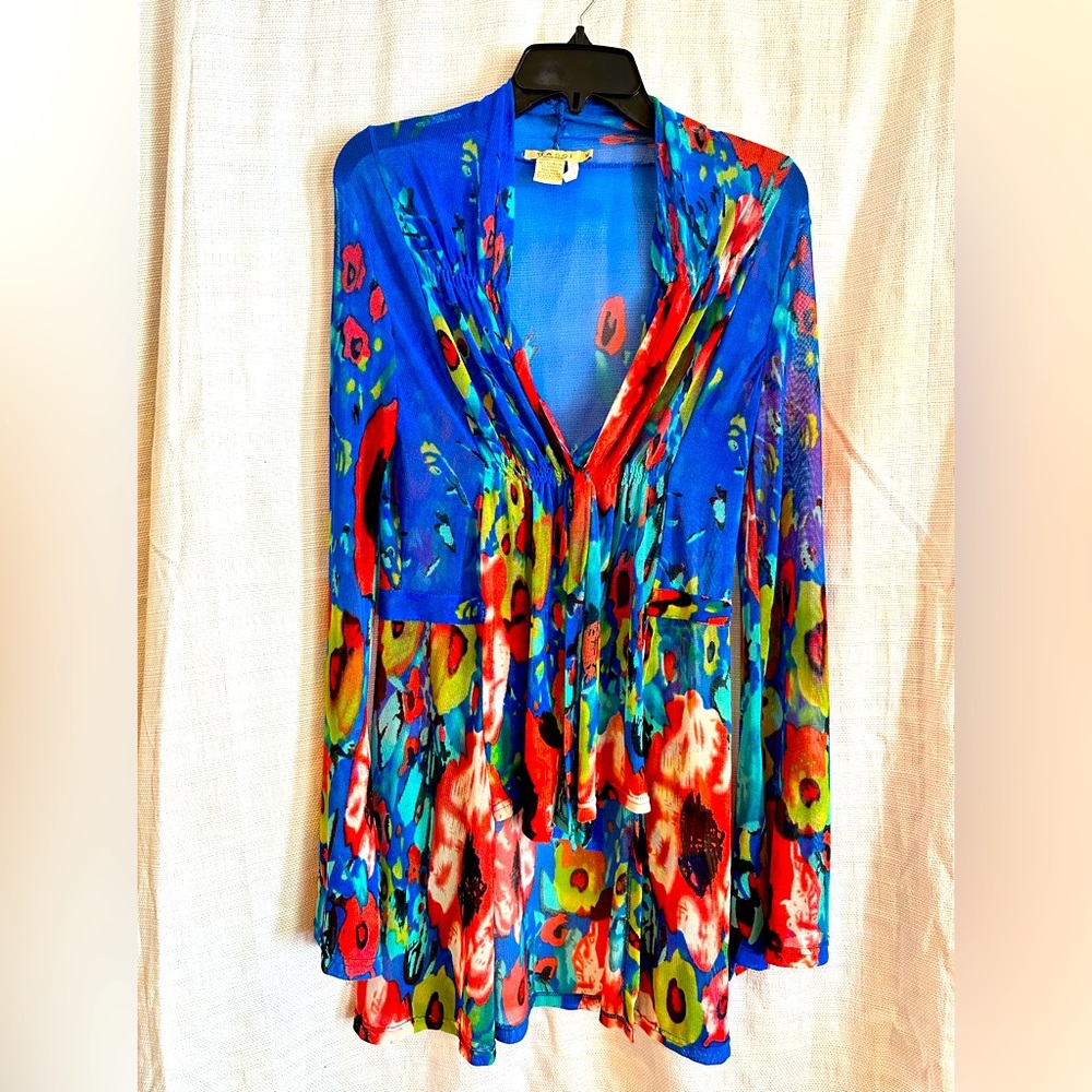 A sheer top, jacket, cover-up